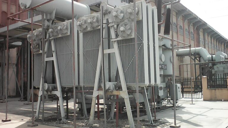 Cooling fans and radiator banks on a power transformer.
