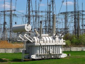 High-voltage transformer installed in an outdoor electrical substation.