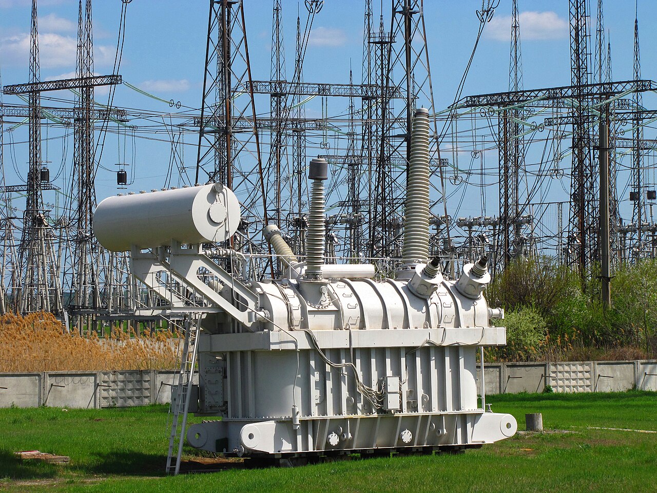 High-voltage transformer installed in an outdoor electrical substation.