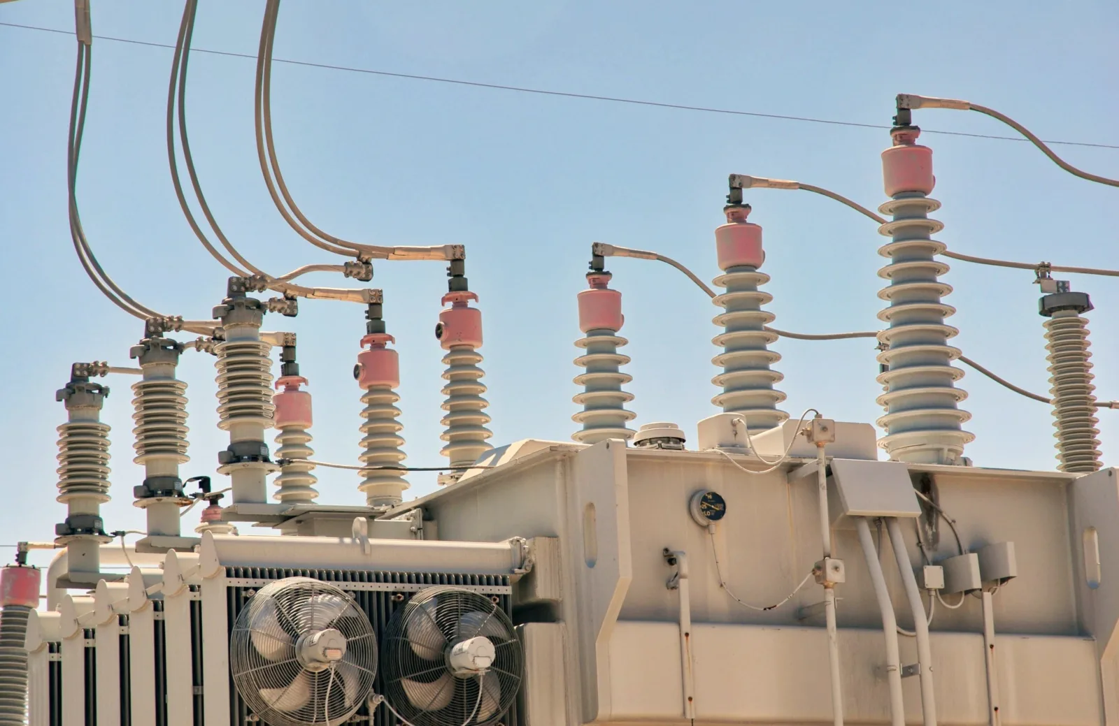 Bushings and cooling fans on top of a large power transformer