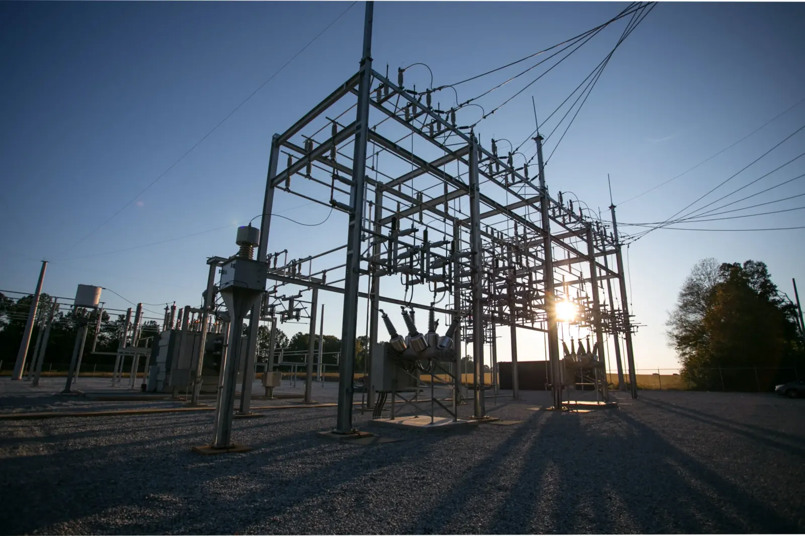 An electrical substation at sunset